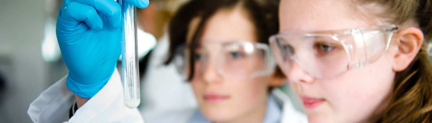 Students looking at a test tube