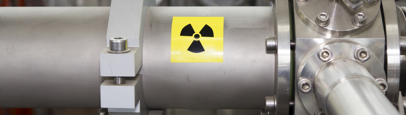 Metal piping with nuclear stickers on