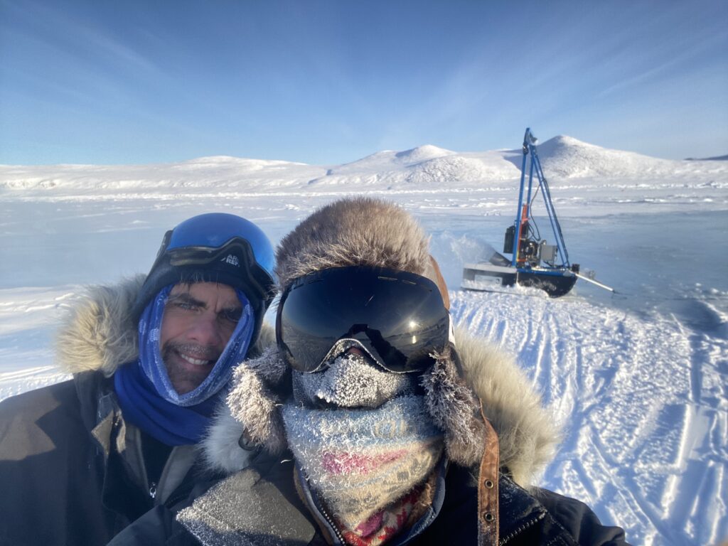 Two people pictured on the Arctic ice cap