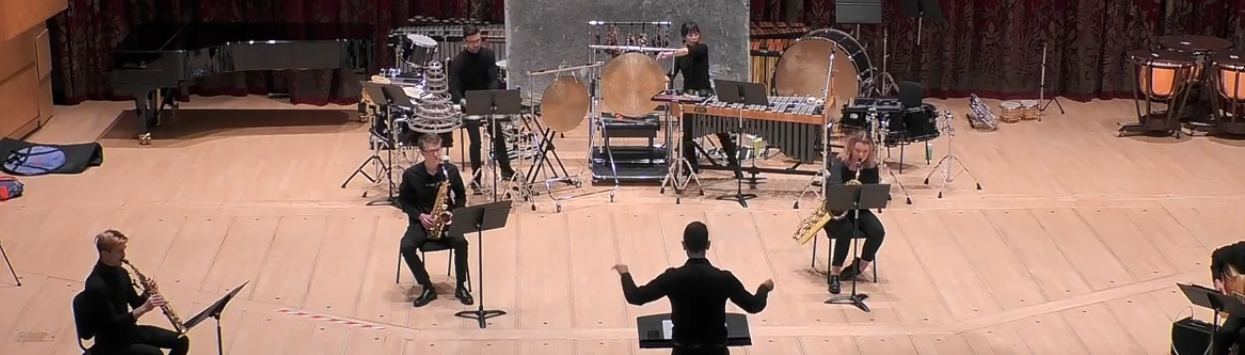 Four musicians and a conductor