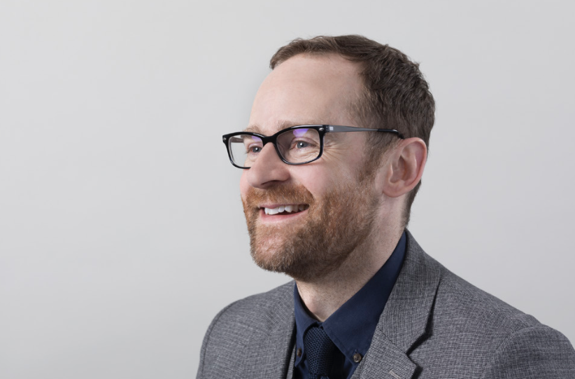Man in glasses smiling