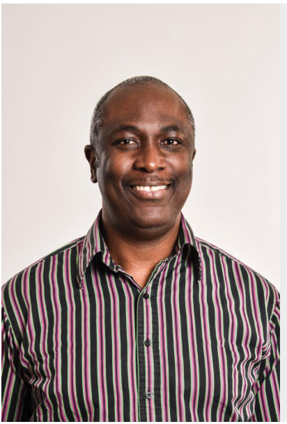 Man in striped shirt smiling