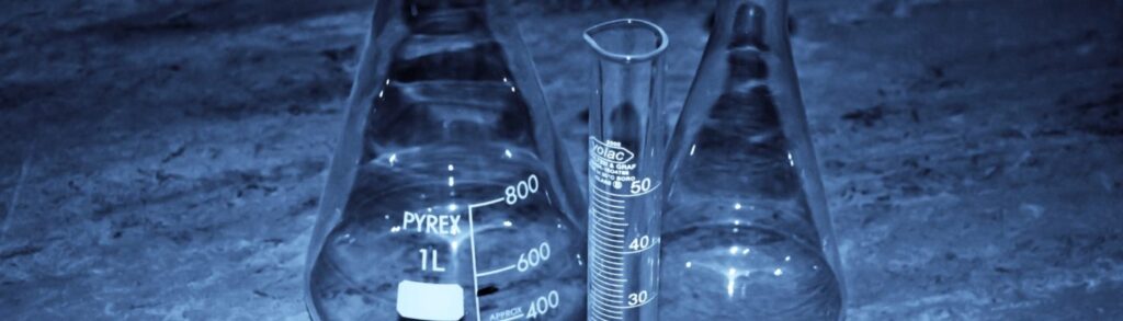 Closeup of two beakers and a test-tube