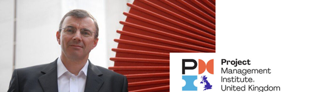 Man facing camera next to logo which reads Project Management Institute United Kingdom