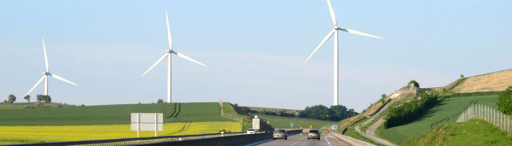 Wind turbines by a road