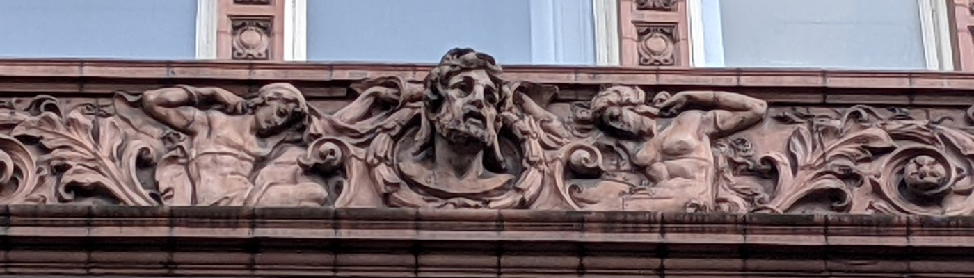 Wizards, monsters, ships and bees: The symbols of Sackville Street Building