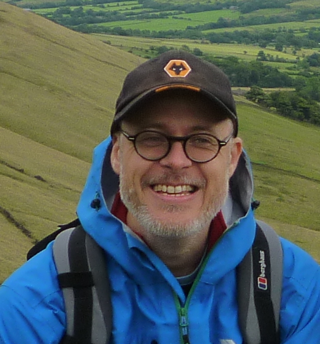 Professor Chris Parkes, hiking in the countryside