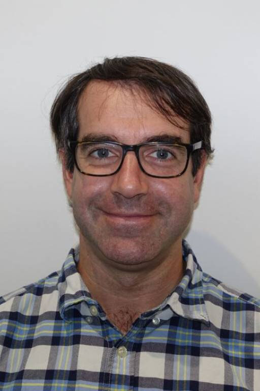 Man in glasses and checked shirt