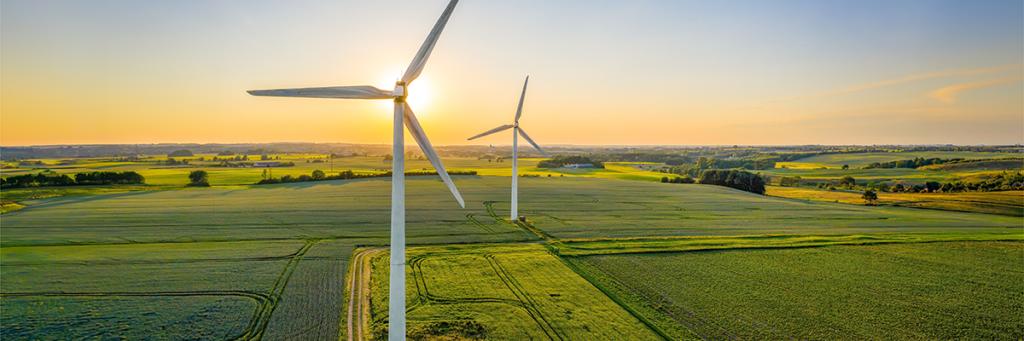 Windmills in the countryside at sunset