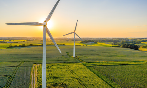 Windmills in the countryside at sunset