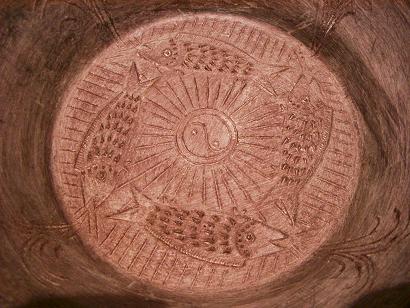 b) Four fishes cast into the bottom of the bowl